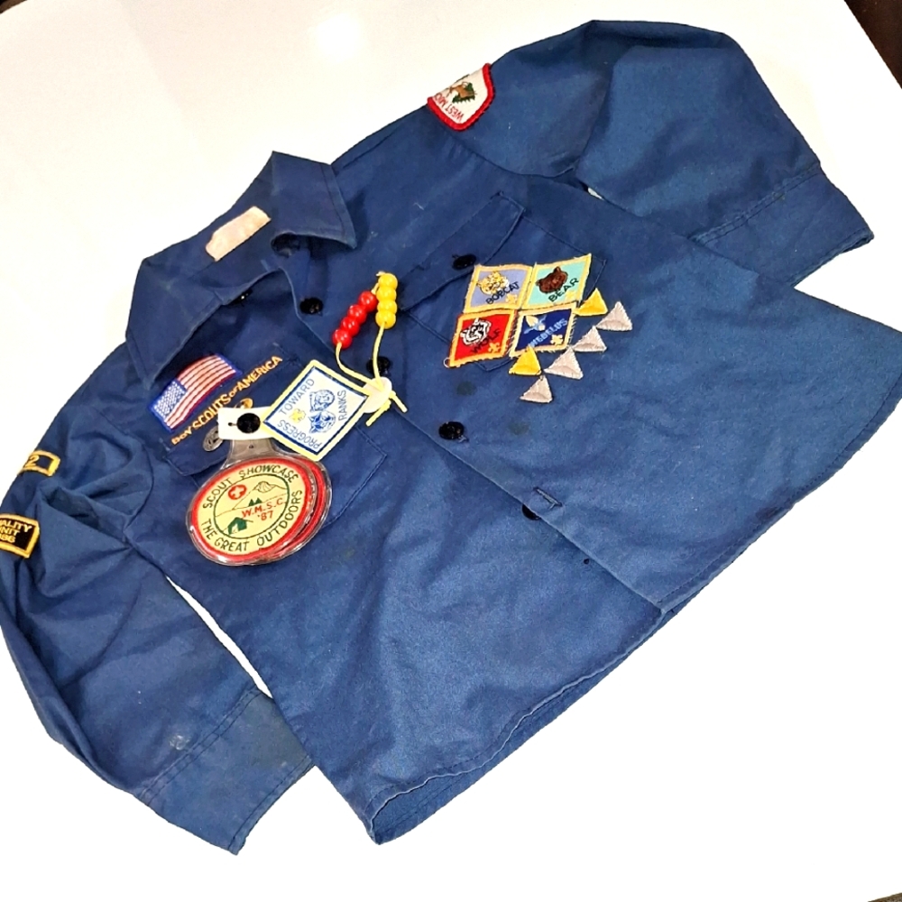 Blue Kids' Cub Scout shirt with badges